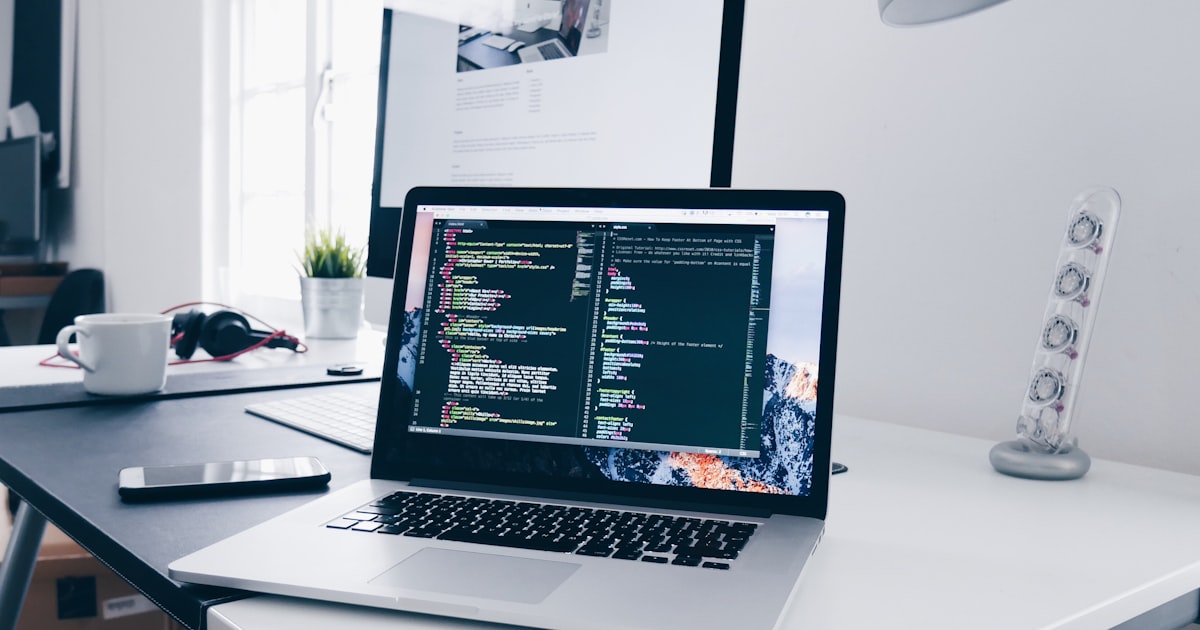 Laptop with code on a desk